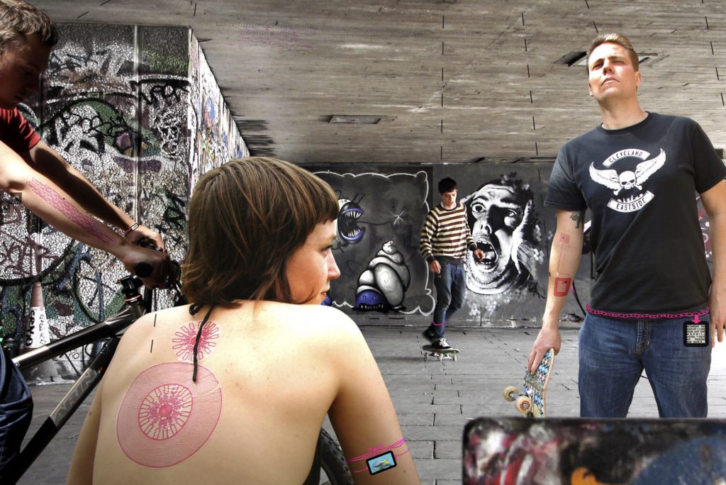Urban scene with woman with RFID tattoo on back and skateboarder with RFID tattoo on arm.